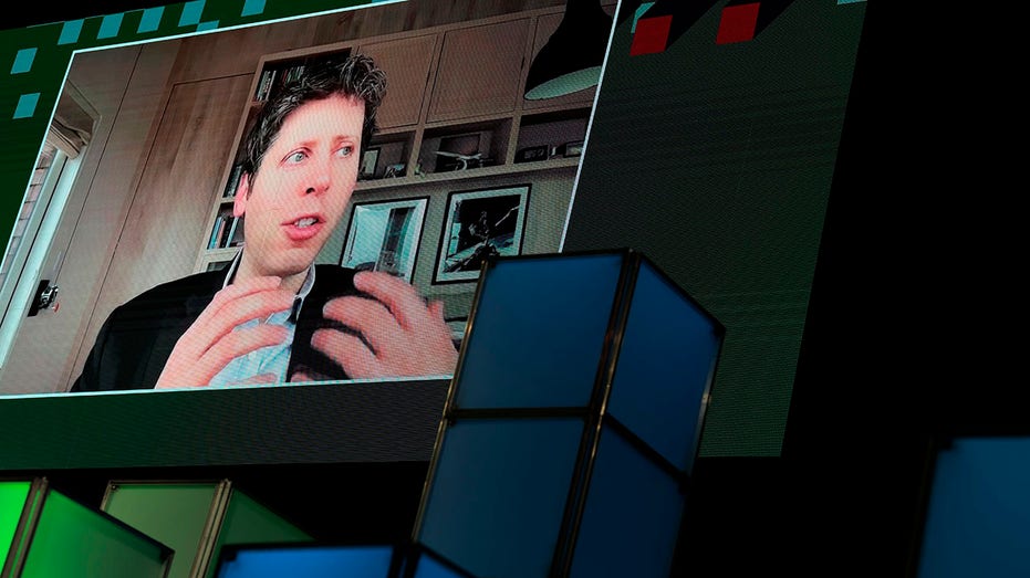 Sam Altman on a screen as he speaks remotely to a DC AI conference