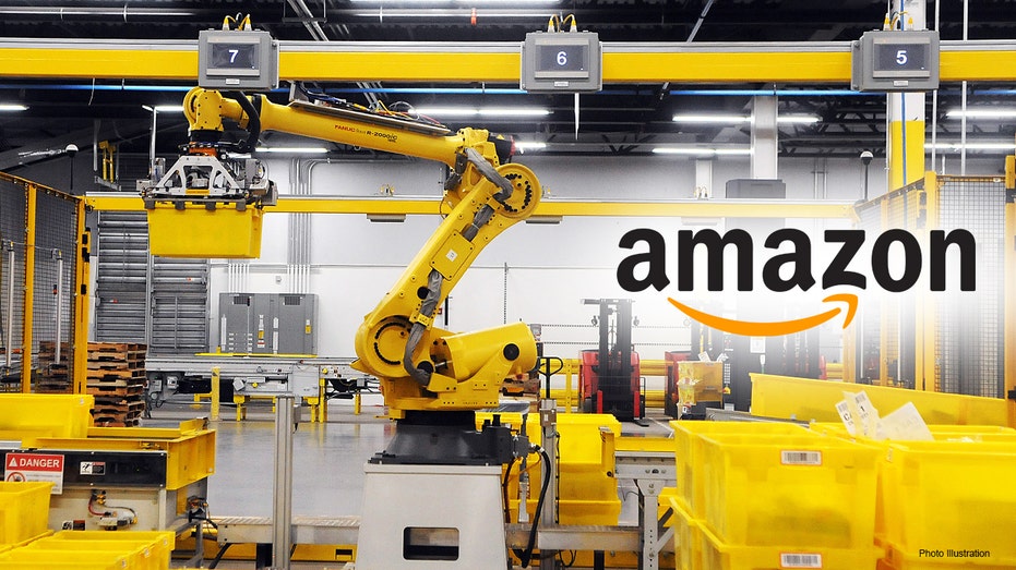 Amazon robot works on the warehouse floor.
