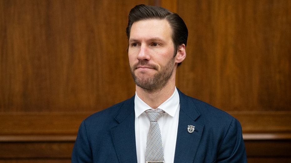 Rep. Pat Harrigan sits during a committee hearing.