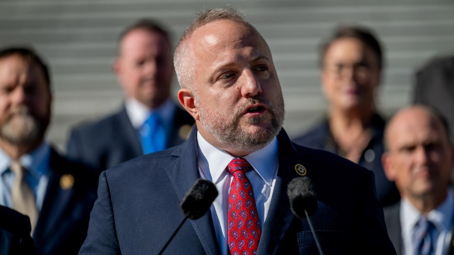 Rep. Russell Fry speaking outside.